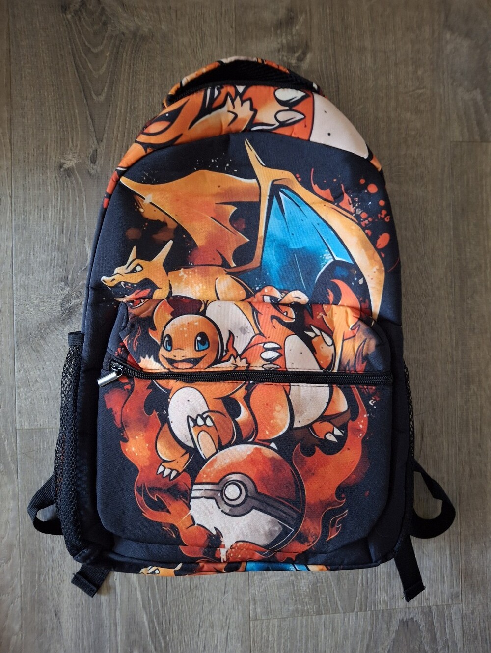 Pokemon Charizard backpack with graphic of Charizard and other Pokémon character